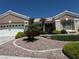 Charming home exterior featuring a manicured front yard with desert landscaping and mature palm trees at 10832 Heritage Hills Dr, Las Vegas, NV 89134