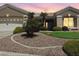 Charming home featuring low-maintenance desert landscaping and mature palm trees enhancing curb appeal at 10832 Heritage Hills Dr, Las Vegas, NV 89134