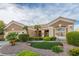 Beautiful home featuring mature palm trees and desert landscaping enhancing its curb appeal at 10832 Heritage Hills Dr, Las Vegas, NV 89134