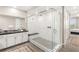Modern bathroom with a glass-enclosed shower, marble-like tiling, and floating bench at 11280 Granite Ridge Dr # 1012, Las Vegas, NV 89135