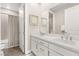 Bright, modern bathroom with double sinks, quartz countertops, and a bathtub with shower at 11280 Granite Ridge Dr # 1012, Las Vegas, NV 89135