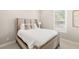 Bright bedroom with a queen sized bed, side tables and natural light streaming through the window at 11280 Granite Ridge Dr # 1012, Las Vegas, NV 89135
