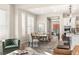Bright dining area with modern light fixtures, and an open floor plan leading to a modern kitchen at 11280 Granite Ridge Dr # 1012, Las Vegas, NV 89135