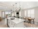 Bright kitchen with an island, stainless steel appliances, and seamless flow to the living area and outdoor patio at 11280 Granite Ridge Dr # 1012, Las Vegas, NV 89135
