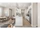 Open-concept kitchen featuring a central island with seating, stainless steel appliances, and a dining area at 11280 Granite Ridge Dr # 1012, Las Vegas, NV 89135
