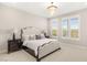 Serene bedroom featuring plush carpeting, a decorative chandelier, and windows with bright natural light at 11280 Granite Ridge Dr # 1012, Las Vegas, NV 89135