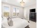 Relaxing primary bedroom with plush decor, bright windows and comfortable furniture with easy access to amenities at 11280 Granite Ridge Dr # 1012, Las Vegas, NV 89135