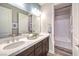 Elegant bathroom featuring double sinks, modern fixtures, and a separate shower/tub for convenience at 1213 Dre Harbor Pl # Lot 83, North Las Vegas, NV 89084