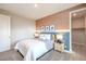 Comfortable bedroom with stylish decor, neutral walls, and a view of a walk-in closet at 1213 Dre Harbor Pl # Lot 83, North Las Vegas, NV 89084