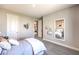 Comfortable bedroom with neutral colors, mirror, and ample space, ideal for relaxation at 1213 Dre Harbor Pl # Lot 83, North Las Vegas, NV 89084