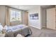 Bright bedroom with a queen bed, large window, and artwork, providing a tranquil retreat at 1213 Dre Harbor Pl # Lot 83, North Las Vegas, NV 89084