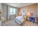 Inviting bedroom with accent wall, desk, and charming décor, creating a warm atmosphere at 1213 Dre Harbor Pl # Lot 83, North Las Vegas, NV 89084