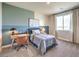 Cozy bedroom featuring a twin bed, desk and neutral color palette, creating a relaxing space at 1213 Dre Harbor Pl # Lot 83, North Las Vegas, NV 89084