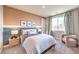 Cozy bedroom featuring a comfortable bed, stylish decor, and a large window with natural light at 1213 Dre Harbor Pl # Lot 83, North Las Vegas, NV 89084