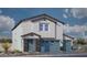 Charming two-story home featuring a three-car garage, blue door and stone facade at 1213 Dre Harbor Pl # Lot 83, North Las Vegas, NV 89084