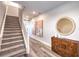 Entryway features a staircase and a wooden console table with a round mirror at 1213 Dre Harbor Pl # Lot 83, North Las Vegas, NV 89084