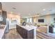 Open-concept kitchen and living area with a large island and modern furnishings at 1213 Dre Harbor Pl # Lot 83, North Las Vegas, NV 89084