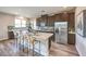 Modern kitchen with a large island, stainless steel appliances, and dark wood cabinetry at 1213 Dre Harbor Pl # Lot 83, North Las Vegas, NV 89084