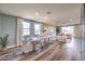 Open-concept living and dining area with hardwood floors, modern decor, and bright natural light at 1213 Dre Harbor Pl # Lot 83, North Las Vegas, NV 89084