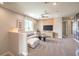 Cozy upstairs living area with comfortable seating, neutral decor, and a large window at 1213 Dre Harbor Pl # Lot 83, North Las Vegas, NV 89084