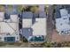 Birds eye view showcasing the home's roof, and pool with the city behind it at 1228 Stellar Rim Ct, Henderson, NV 89012