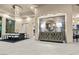 Open dining and living area with elegant lighting, modern decor and seamless flow for entertaining at 1228 Stellar Rim Ct, Henderson, NV 89012