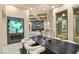 Bright dining room features a decorative display niche, modern lighting, and view into spacious living room at 1228 Stellar Rim Ct, Henderson, NV 89012