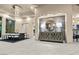Open dining and living area with elegant lighting, modern decor and seamless flow for entertaining at 1228 Stellar Rim Ct, Henderson, NV 89012