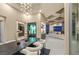 Luxurious dining area with modern accents and an open floor plan that flows into the living room at 1228 Stellar Rim Ct, Henderson, NV 89012