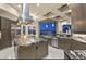 Well-equipped kitchen featuring a large center island, custom cabinets, and sleek stainless steel appliances at 1228 Stellar Rim Ct, Henderson, NV 89012