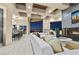 Bright living room features a modern fireplace, plush white seating and a built-in bar overlooking city views at 1228 Stellar Rim Ct, Henderson, NV 89012