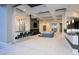 Open concept living area with sleek bar seating and adjacent lounge space perfect for entertaining at 1228 Stellar Rim Ct, Henderson, NV 89012