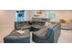 Modern living room with a luxurious sectional sofa and stylish decor at 1228 Stellar Rim Ct, Henderson, NV 89012