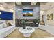Cozy living room with modern fireplace, sleek decor, and an open layout for seamless entertaining at 1228 Stellar Rim Ct, Henderson, NV 89012