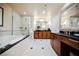 Luxurious bathroom with a soaking tub, dual vanities, and a glass-enclosed shower at 135 Harmon Ave # 3220, Las Vegas, NV 89109