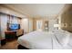 Comfortable bedroom with a built-in desk and bathroom entrance at 135 Harmon Ave # 3220, Las Vegas, NV 89109
