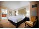 Bright bedroom with comfortable seating and an adjacent bathroom at 135 Harmon Ave # 3220, Las Vegas, NV 89109