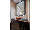 Detailed view of the dresser showing a mirror, ice bucket, water bottles, and a unique wavy design at 135 Harmon Ave # 3220, Las Vegas, NV 89109