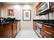 Efficient kitchen with stainless steel appliances and dark wood cabinetry at 135 Harmon Ave # 3220, Las Vegas, NV 89109