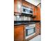 Modern kitchen featuring stainless steel oven and range with custom wood cabinets at 135 Harmon Ave # 3220, Las Vegas, NV 89109