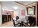 Well-equipped kitchenette and a dining area featuring a glass table and seating for four, perfect for in-room dining at 135 Harmon Ave # 3220, Las Vegas, NV 89109