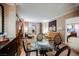 Comfortable living room with seating and a glass table under bright, soft lighting at 135 Harmon Ave # 3220, Las Vegas, NV 89109
