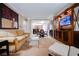 Expansive living area featuring a flat-screen TV, sofa, and dining area adjacent to a convenient kitchenette at 135 Harmon Ave # 3220, Las Vegas, NV 89109