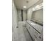 Bathroom featuring a granite countertop, a modern vanity, and tiled shower at 1405 Vegas Valley Dr # 380, Las Vegas, NV 89169