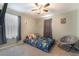 The bedroom features grey walls, dark curtains, and a queen-size bed at 162 Sand Lake St, Henderson, NV 89074