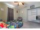 View of bedroom featuring carpet floors, ceiling fan, and closet with built-in shelving at 162 Sand Lake St, Henderson, NV 89074