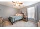 Comfortable bedroom with grey walls, plush carpeting, and a full-size bed at 162 Sand Lake St, Henderson, NV 89074