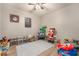 Playful room with light gray walls, wood floors, and abundant toys and decorations at 162 Sand Lake St, Henderson, NV 89074