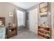 Well-lit bedroom with grey walls, carpeted floors, and a side table at 162 Sand Lake St, Henderson, NV 89074