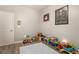 Playful room with light gray walls, wood floors, and abundant toys and decorations at 162 Sand Lake St, Henderson, NV 89074